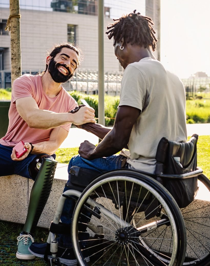 Friends with disabilities shaking hands